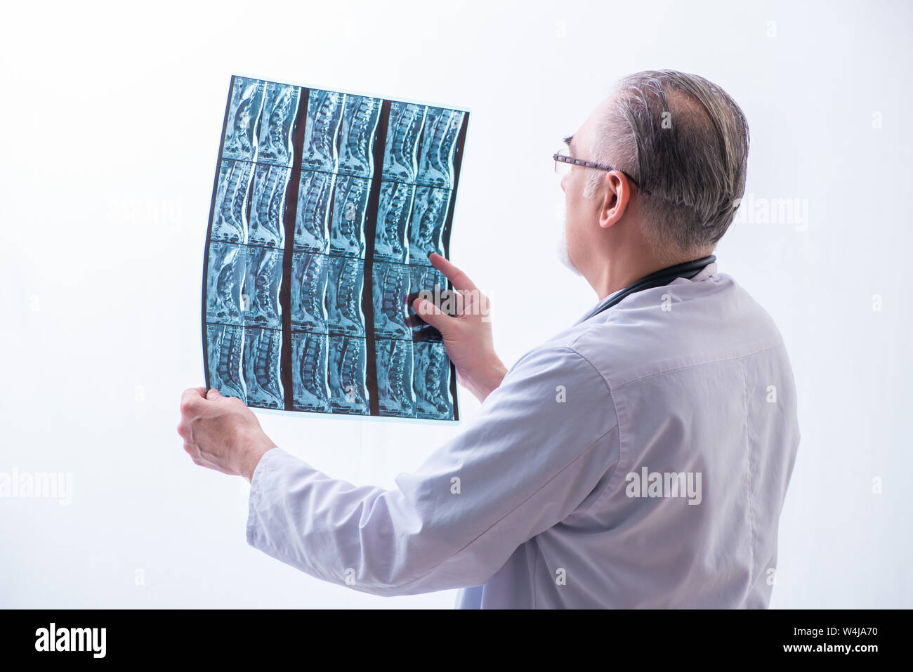 Rear view old doctor working hi-res stock photography and images - Alamy