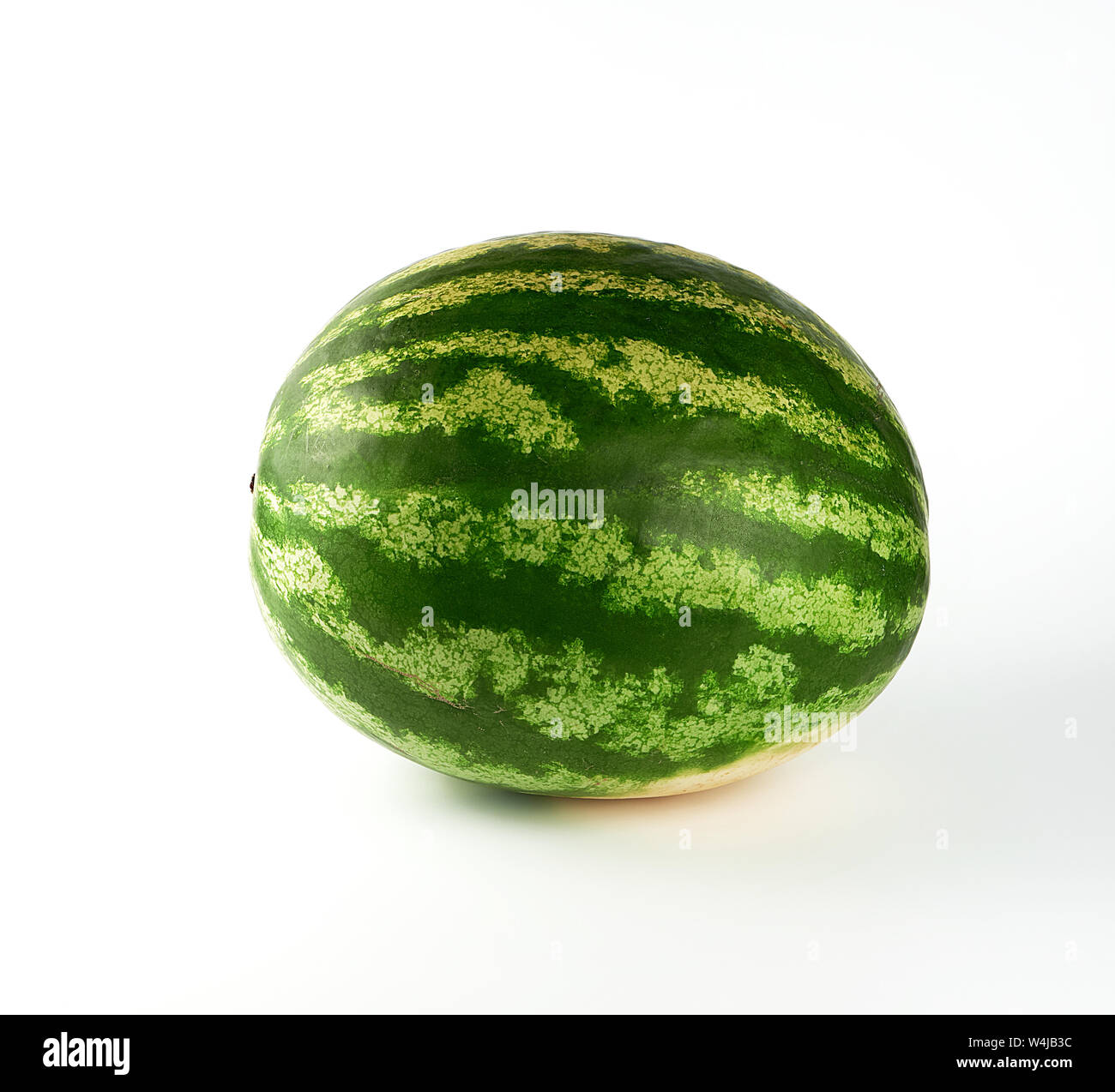 big green striped whole watermelon on a white background, summer berry ...