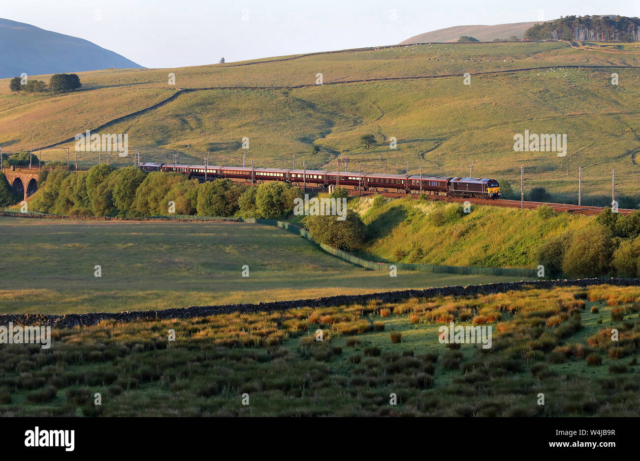 67006 & 67005 pass Greenholme with the Royal Train taking the Queen to Scotland. Stock Photo
