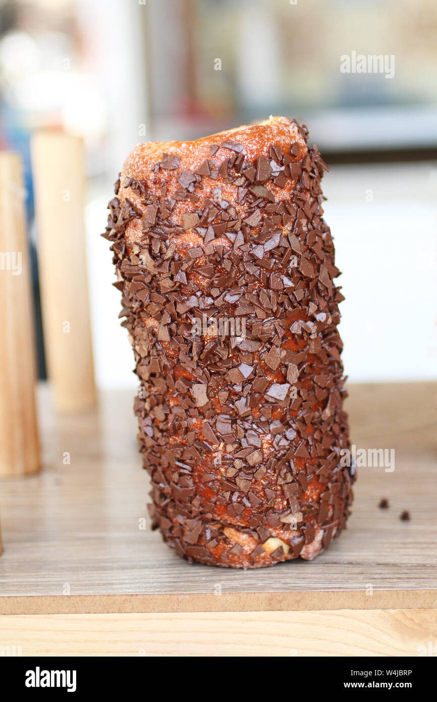 Traditional Hungarian roll kurtosh with chocolate on the counter in the pastry shop Stock Photo