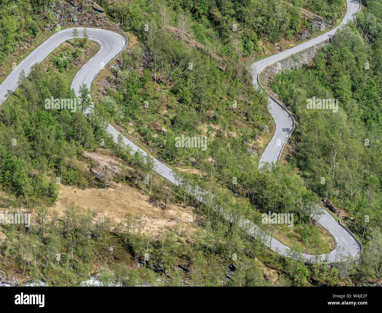 mountain pass road over the Gaularfjell northwest of the Sognefjord,  serpentines of a winding road, early summer, Norway Stock Photo