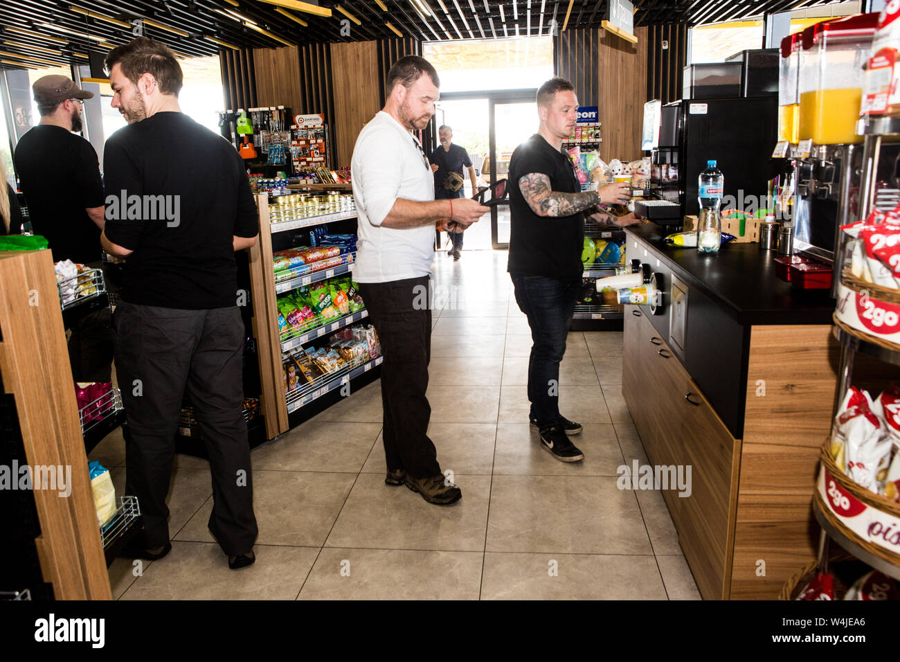 Travelers make stop to have cup of coffee at petrol station in Novi Petrivtsi on way from Kiev to visit Chernobyl as tourism booming after HBO film. Stock Photo