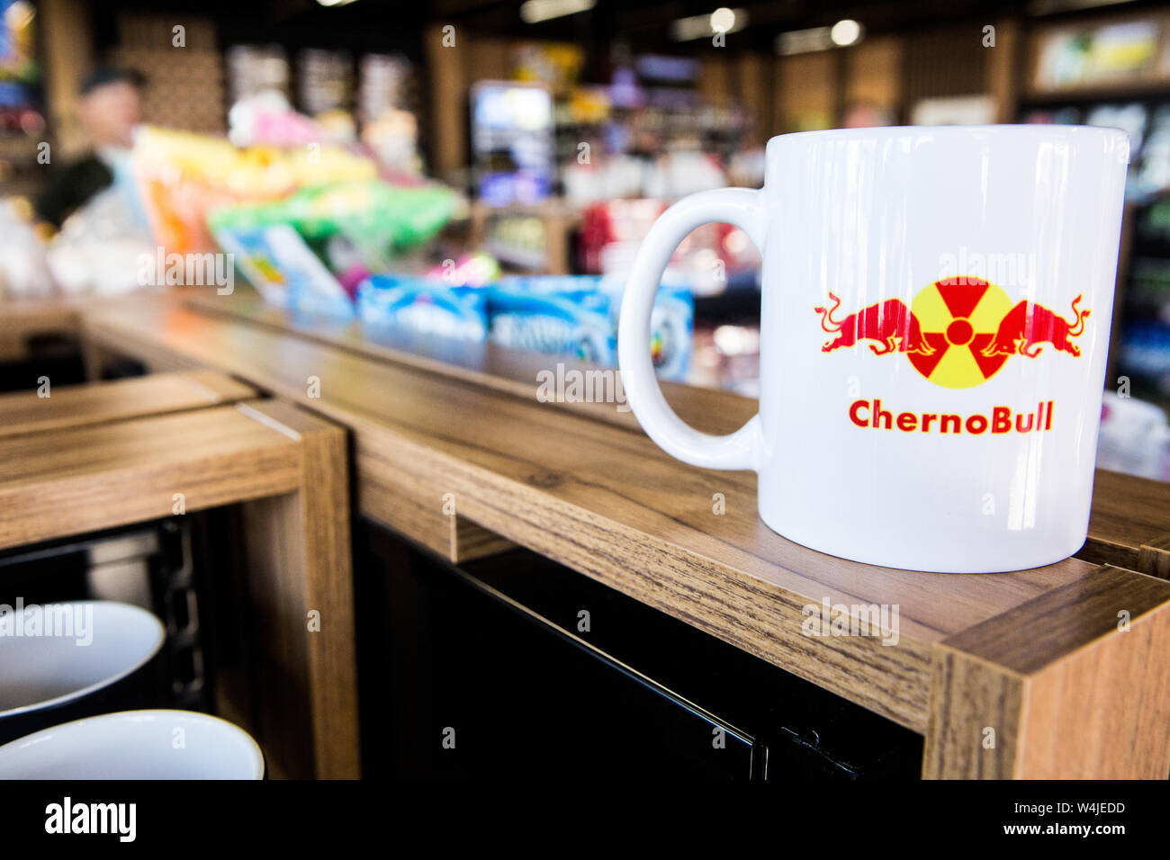 White ChernoBull mug with nuclear symbol on a shelf with souvenirs at petrol station in Novi Petrivtsi,25 km from Kiev on way to Chernobyl (134km). Stock Photo