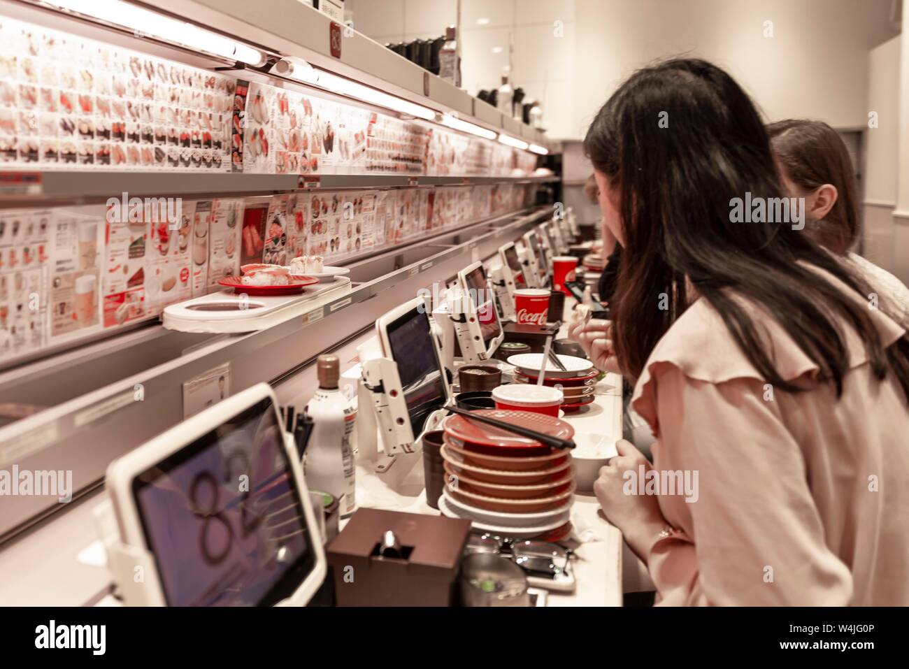 Sushi Restaurant Uobei Shibuya Dogenzaka with Sushi Conveyor, Shibuya, Tokyo, Japan Stock Photo