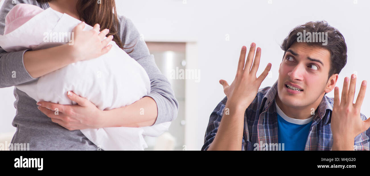 Young dad cannot stand baby crying Stock Photo - Alamy