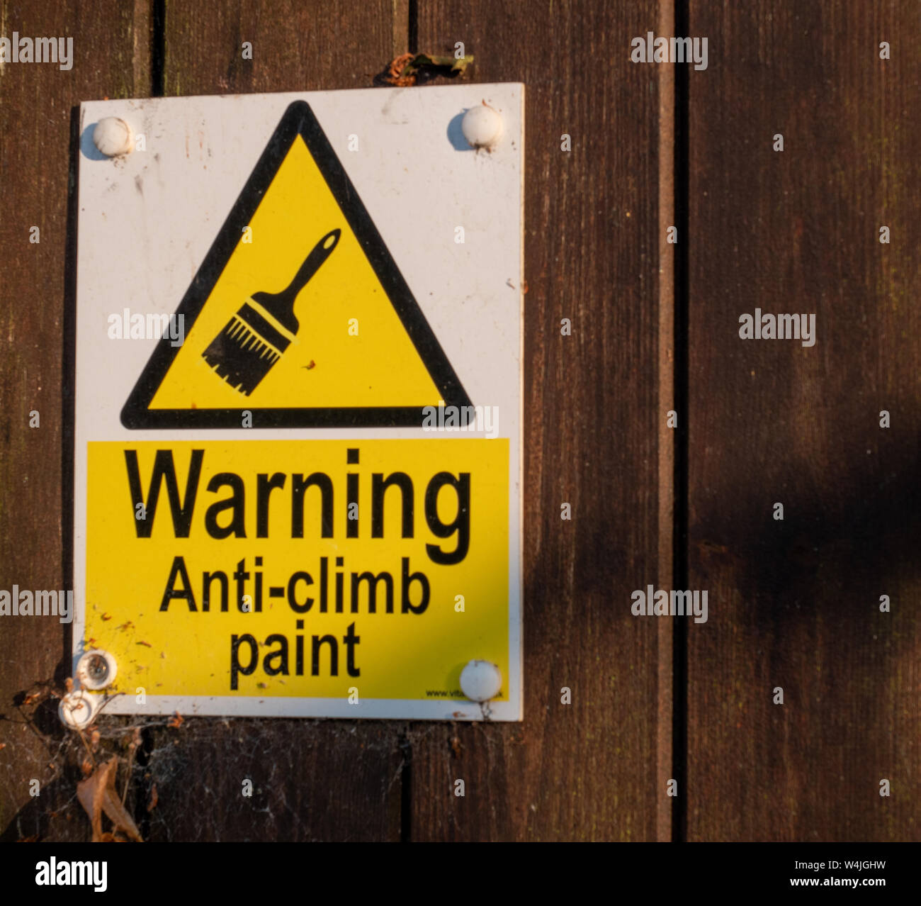 An anticlimb paint warning sign Stock Photo Alamy