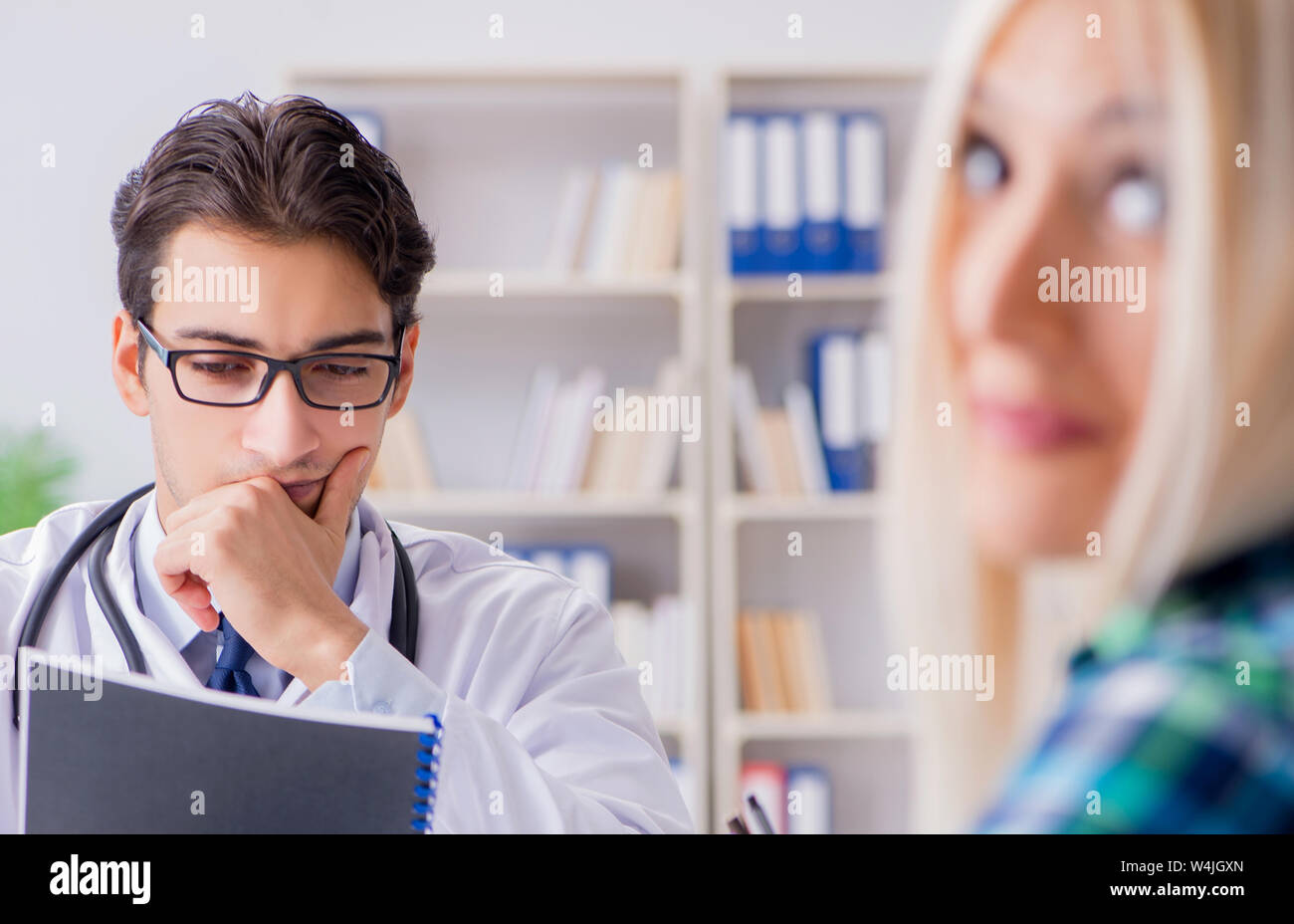 Patient Visiting Doctor For Medical Check up In Hospital Stock Photo