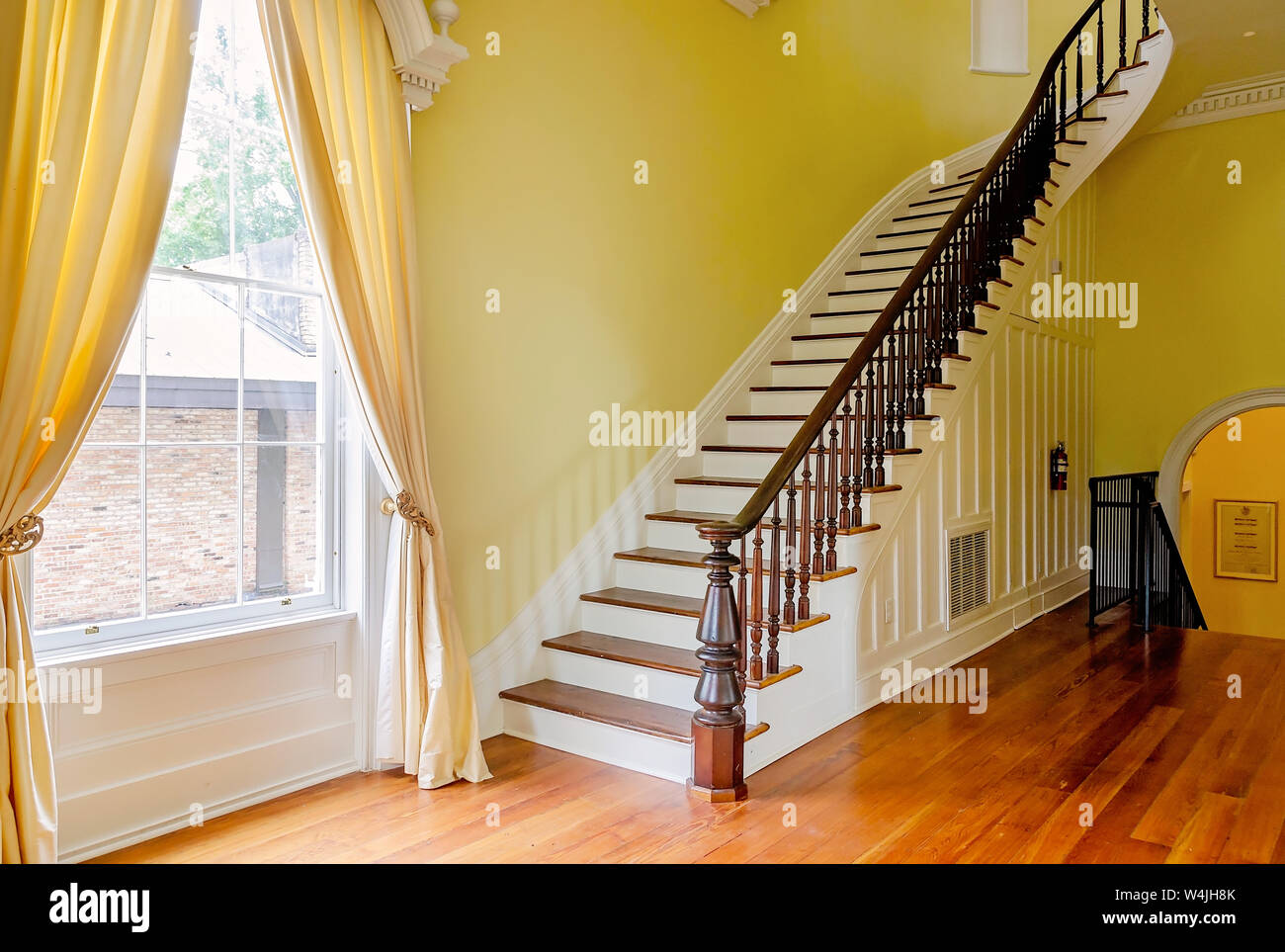The grand staircase of the 1857 historic home is pictured during the Post 3 open house, July 21, 2019, in Mobile, Alabama. Stock Photo
