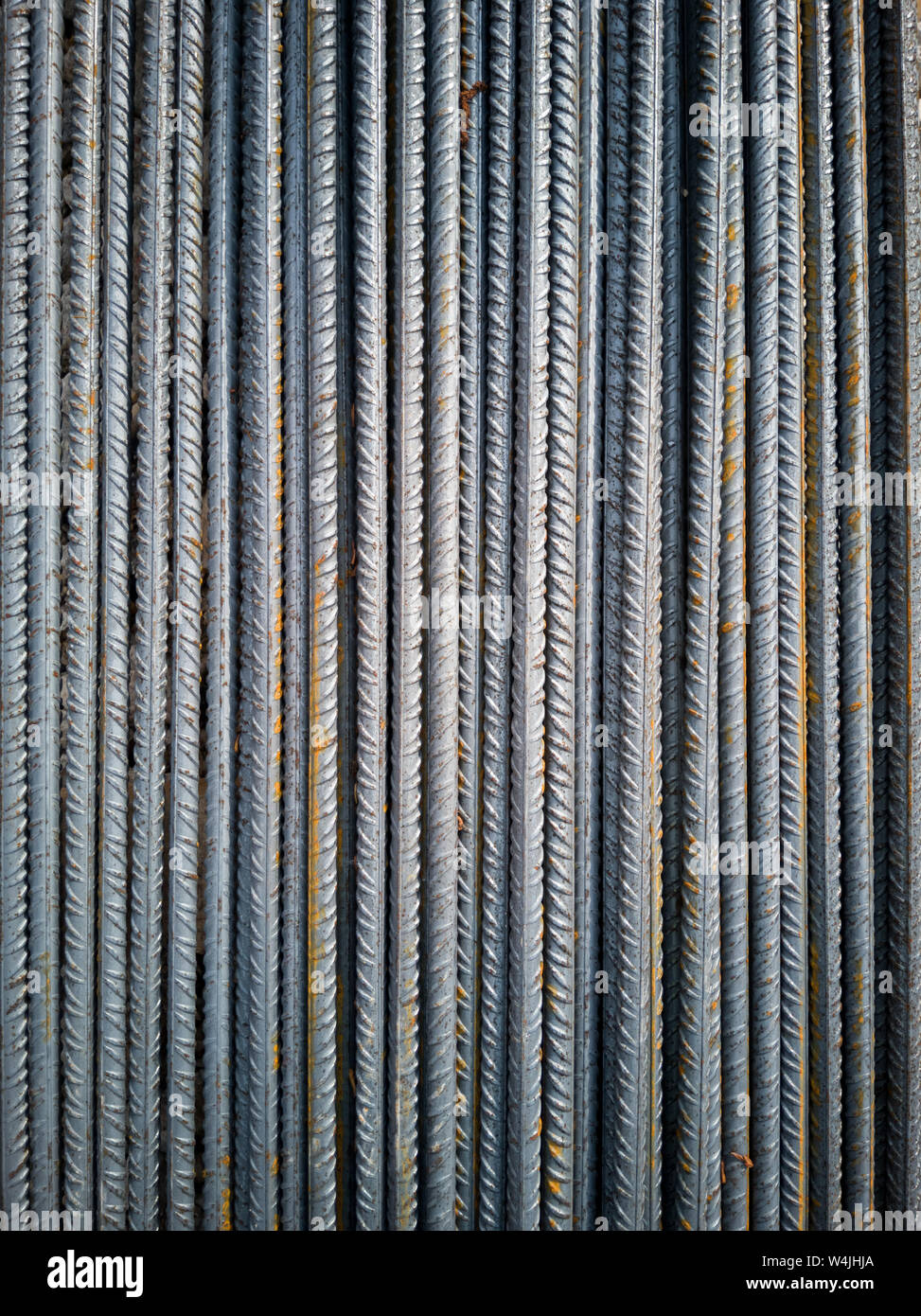 Stockpile of steel bars in construction site to execute reinforced concrete. Stock Photo
