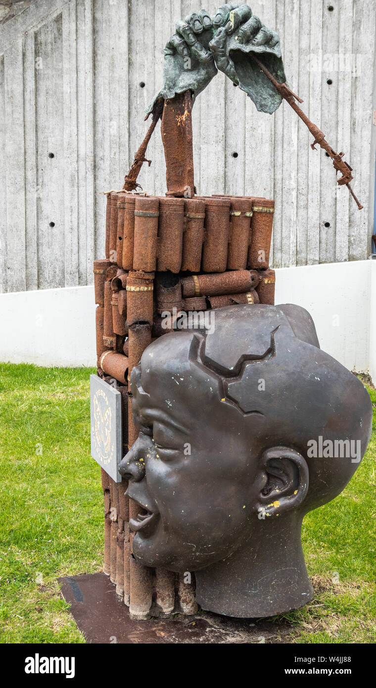 Diksmuide, Flanders, Belgium -  June 19, 2019: Old war-iron monument at IJzertoren, tallest peace monument of WW 1. Rusty bomb shells, crying baby hea Stock Photo