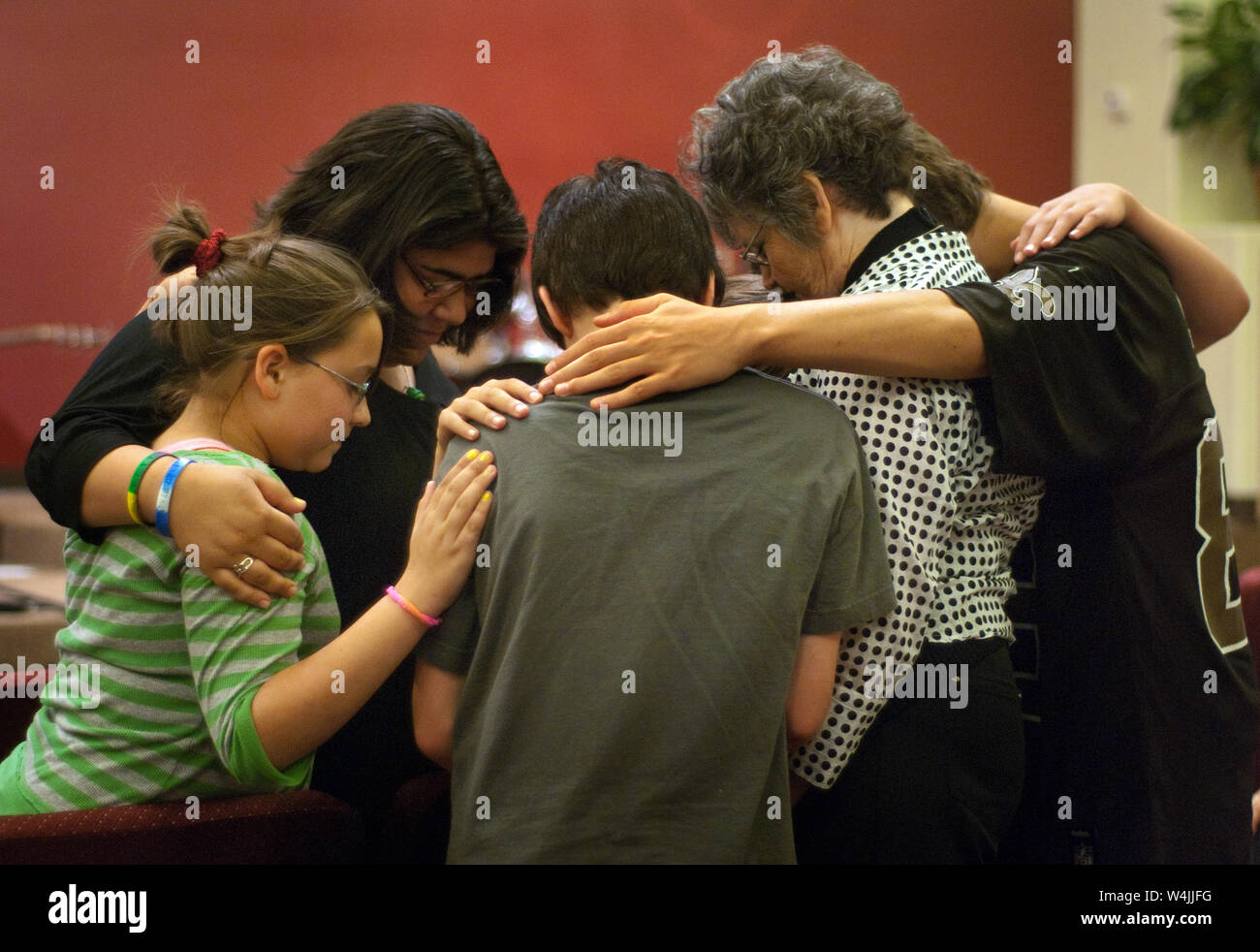 A small group gathers to pray during a Community Crisis prayer service May 26, 2010 at First Baptist Church in Chalmette, Louisiana. Stock Photo