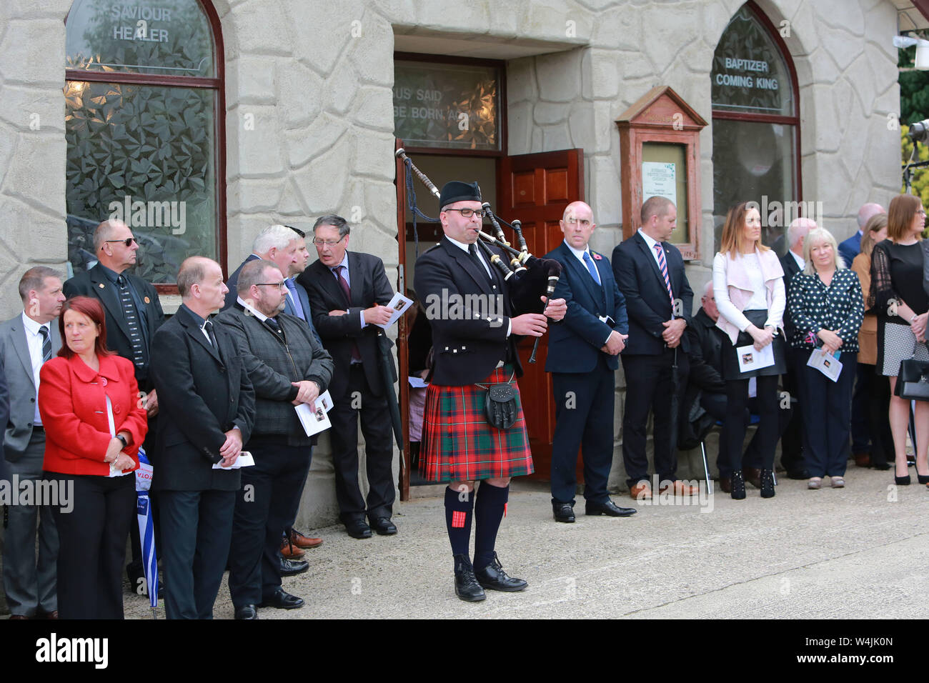 A single piper plays at the Funeral of Willie Frazer outside Five Mile Hill Full Gospel Fellowship Church on the Maytown Road, County Armagh, Monday July 1st, 2019. (Photo by Paul McErlane for the Belfast Telegraph) Stock Photo