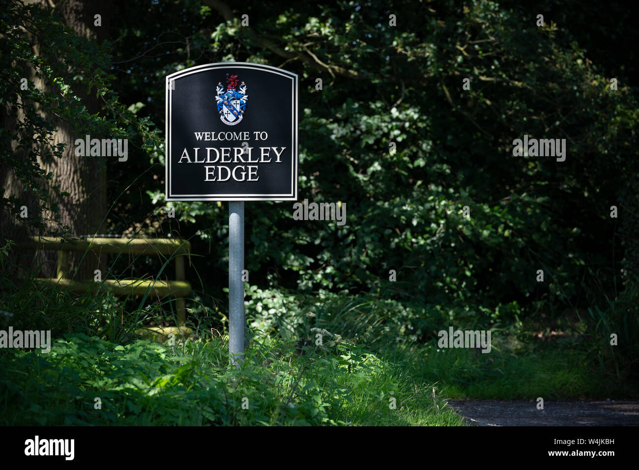 A sign welcomes people to the small town of Alderley Edge in Cheshire, UK. Stock Photo
