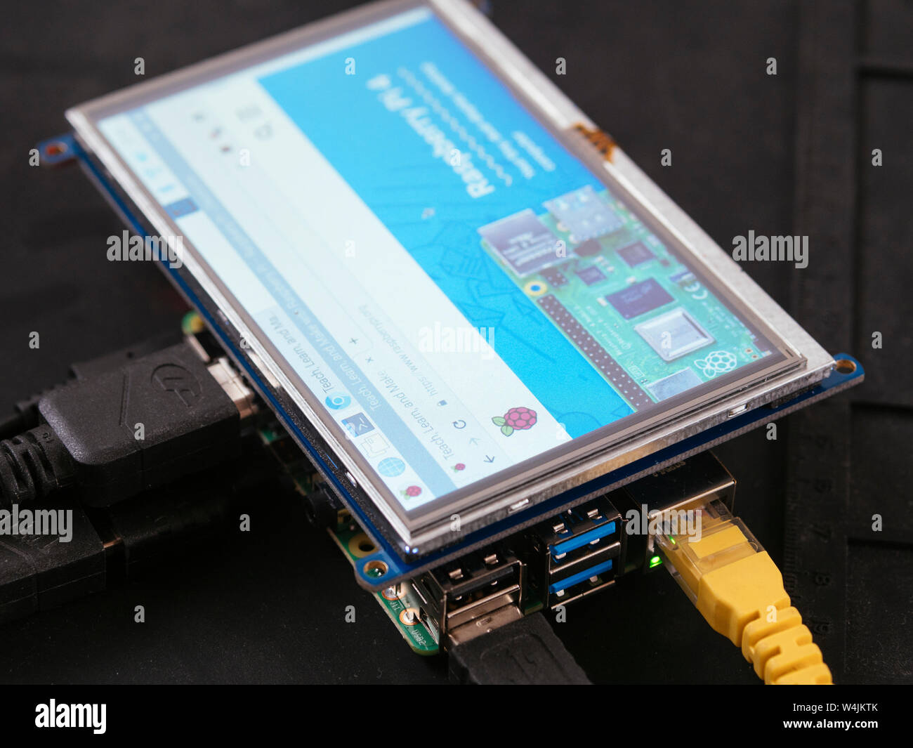 Raspbery Pi 4 Model B with a 5 inch LCD touchscreen display. Stock Photo