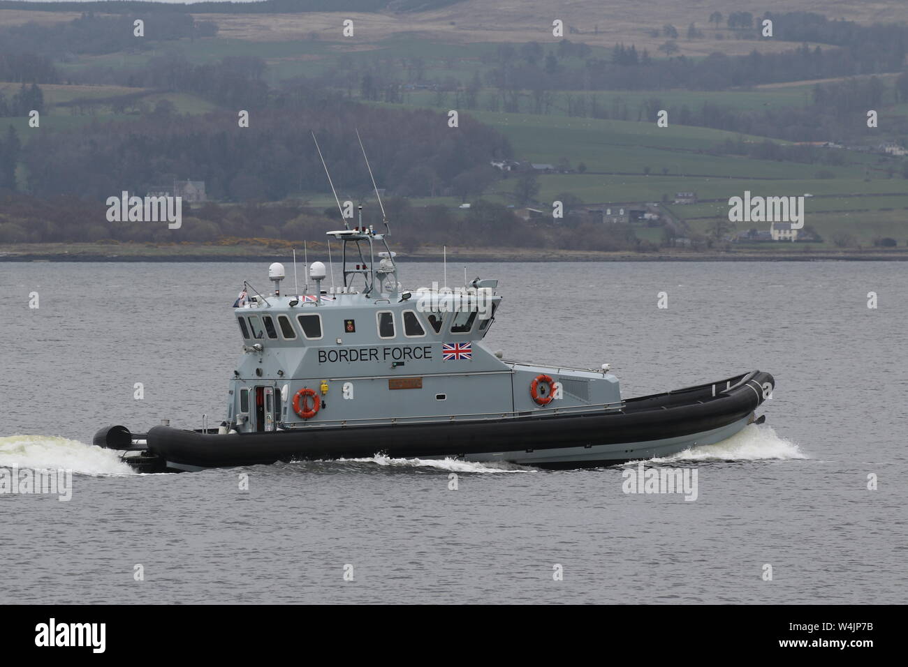 HMC Active, a coastal patrol vessel operated by the UK Border Force, passing East India Harbour on the Firth of Clyde. Stock Photo