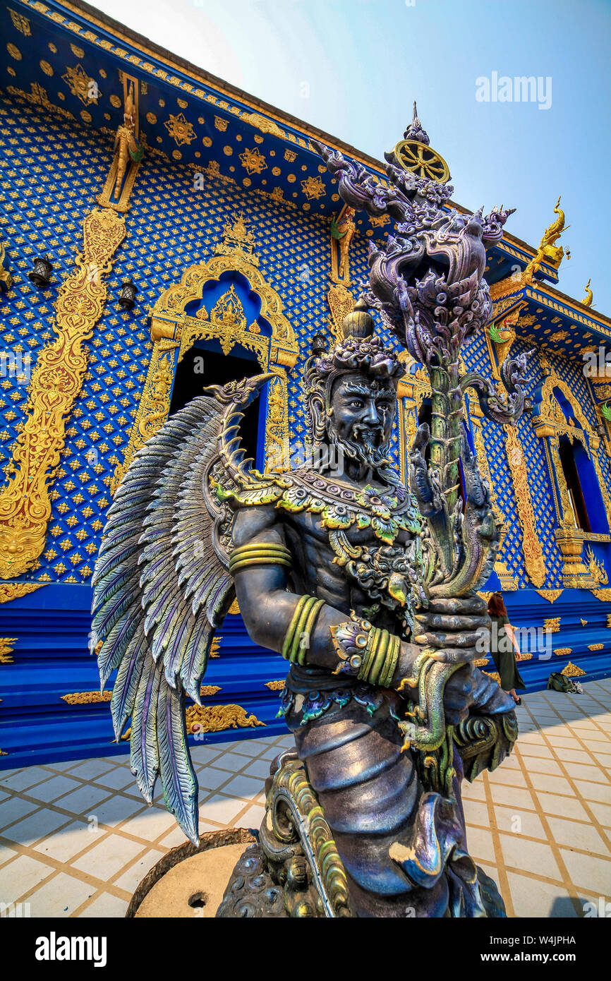 Garuda warrior angel Buddhist statue stands outside the new Blue Temple of Wat Rong Seua Ten near Chiang Rai, Northern Thailand. Stock Photo
