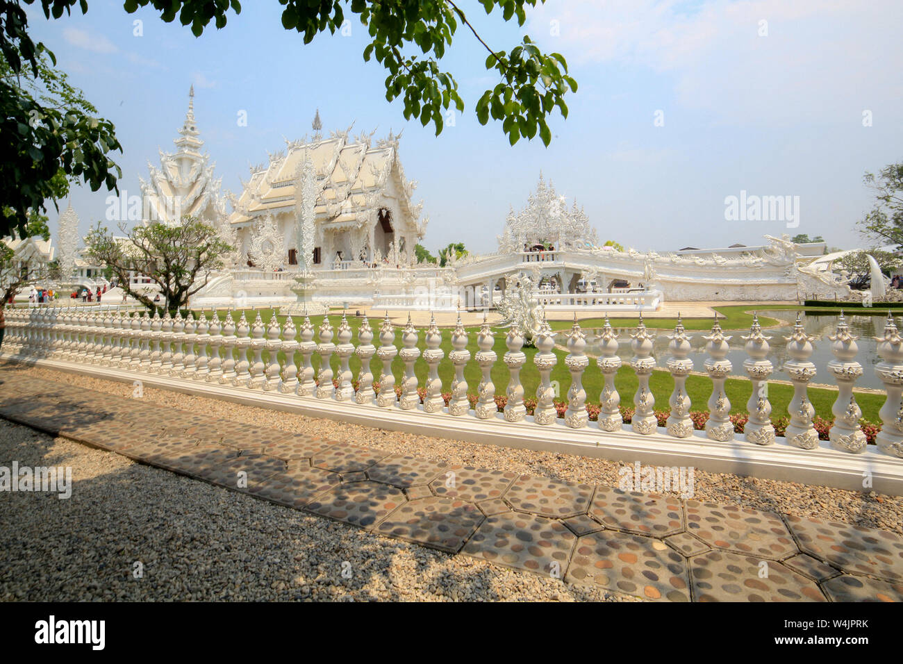 Scenic view of Wat Rong Khun, White Temple, a privately owned tourist attraction in Chiang Rai, Thailand. Stock Photo