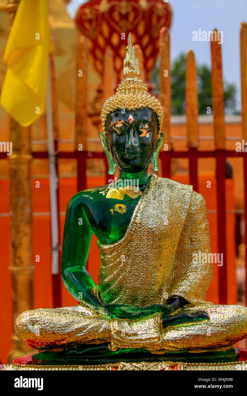 Replica Green Emerald Buddha statue trimmed with gold at the Wat Phra That Doi Suthep temple in Chiang Mai, Northern Thailand. Stock Photo