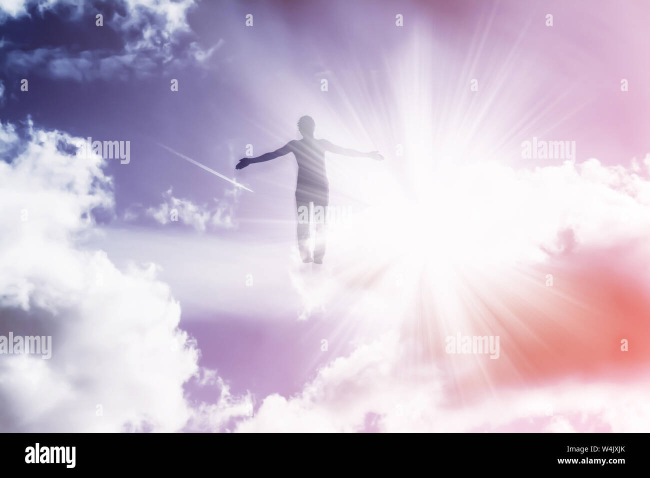 Silhouette Of A Man Flying Up In The Sky In The Bright Rays Of The Sun With Arms Spread Apart Stock Photo Alamy Silhouette Of A Man Flying Up In The Sky In The Bright Rays Of The Sun With Arms Spread Apart Stock Photo Alamy