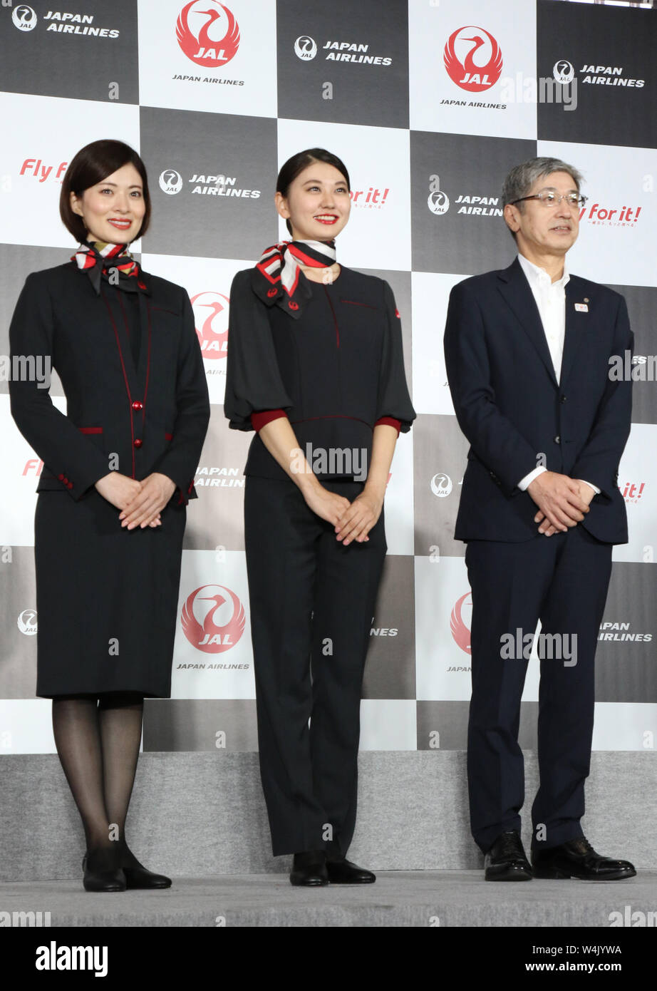 Tokyo, Japan. 23rd July, 2019. Japan Airlines (JAL) president Yuji Akasaka  and cabin attendants pose for photo as JAL unveils the new uniforms for the  flight crews, cabin attendants, ground crews, cargo