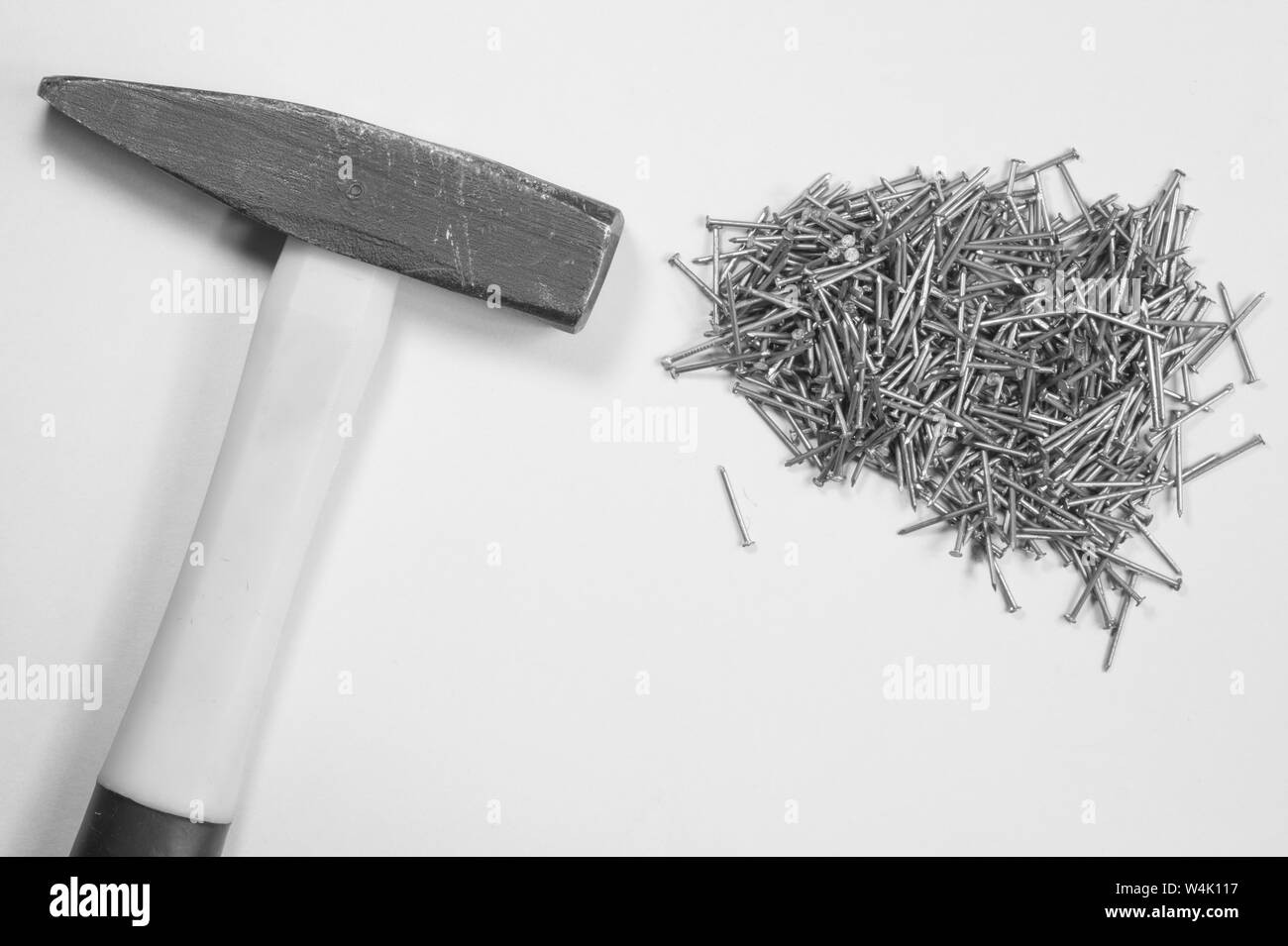 Hammer and metal nails isolated on white background Stock Photo Alamy