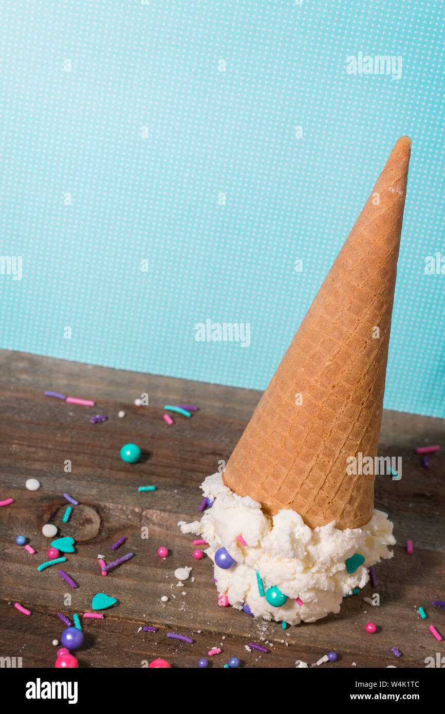 Vanilla Ice Cream in a Sugar Cone on a Blue Background Stock Photo - Alamy