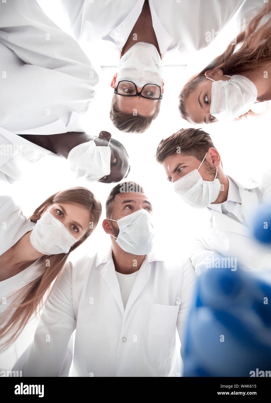surgeons looking down patient hospital Stock Photo - Alamy