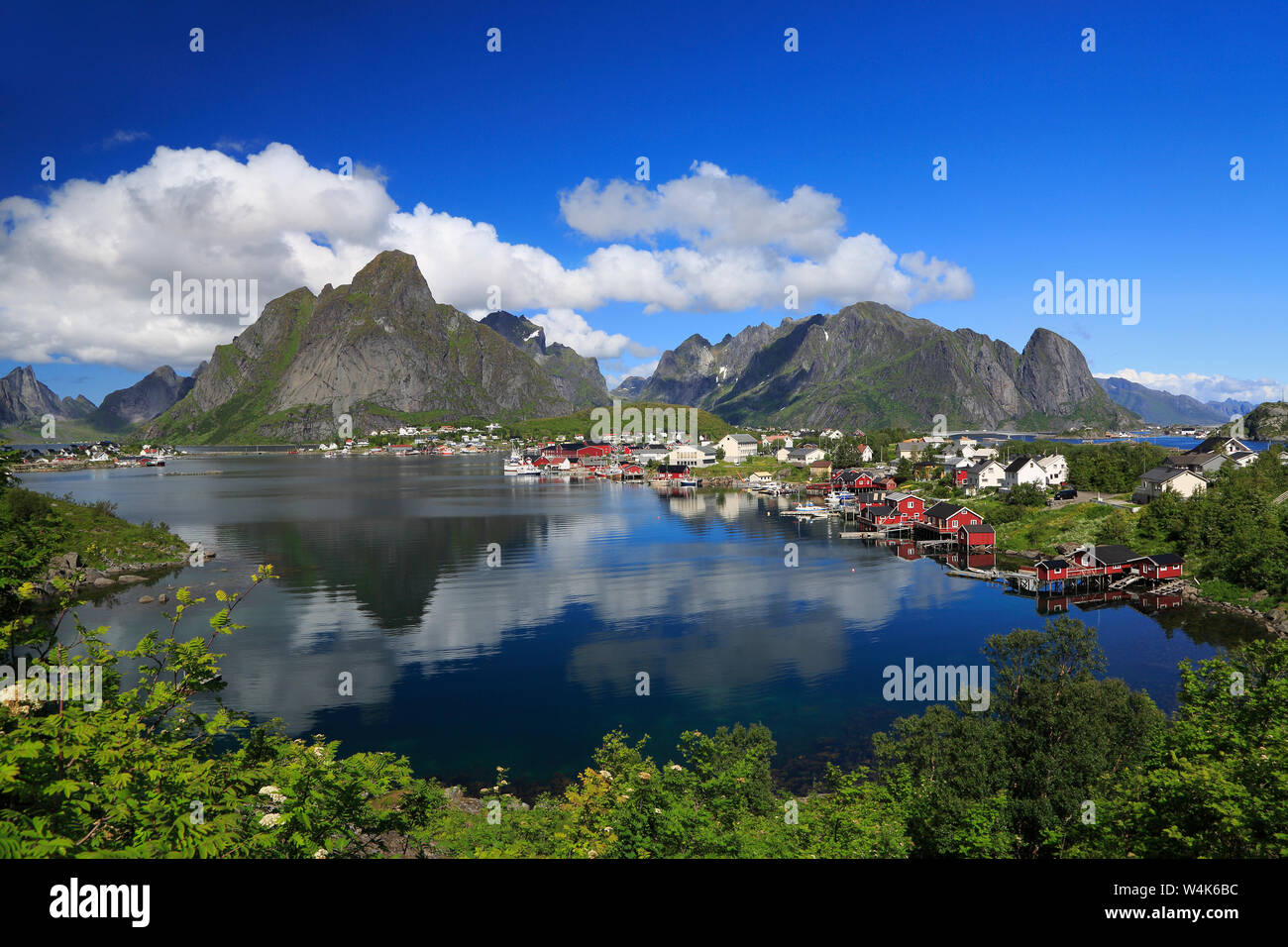 Traditional red colorful Norwegian fishing houses in Reine,  Lofoten Islands in northern Norway Stock Photo