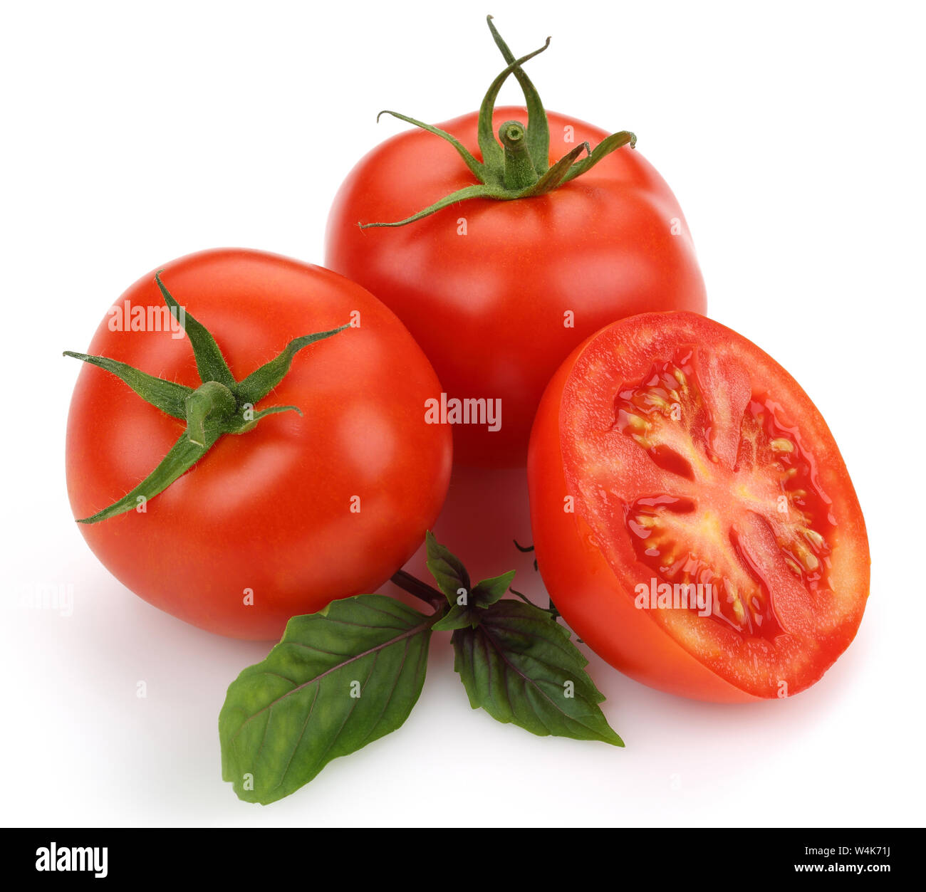 Fresh tomatoes and basil leaves isolated on white background Stock ...