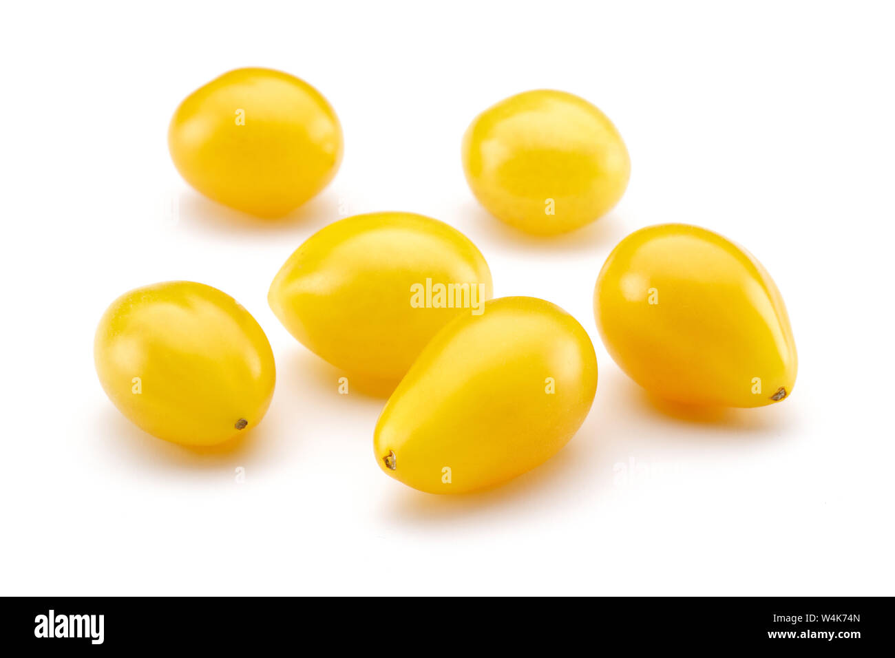 Yellow cherry tomatoes isolated on white background Stock Photo