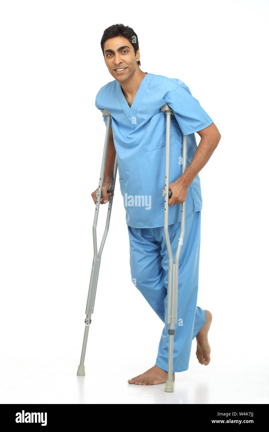 Patient walking with the help of crutches Stock Photo Alamy