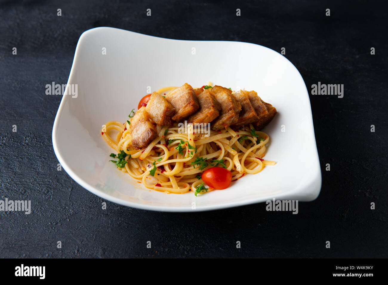crispy Pork belly spaghetti with background Stock Photo Alamy