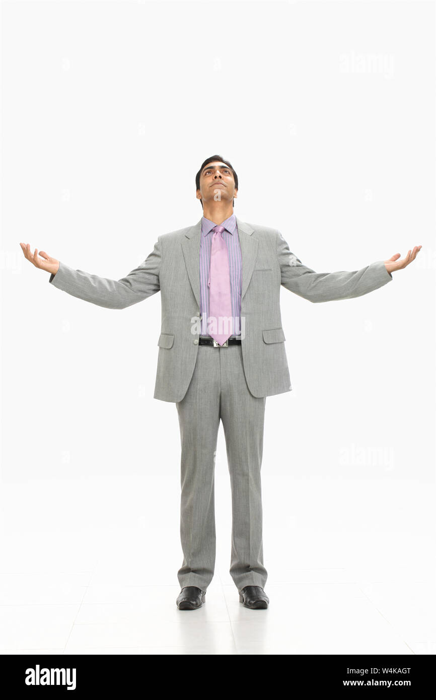 Businessman standing with his arm outstretched Stock Photo