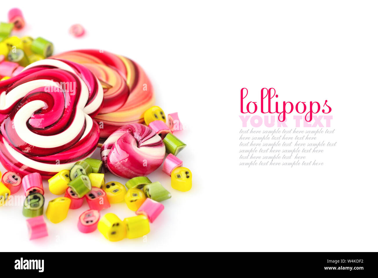Colorful candies and lollipops on a white background with empty space Stock Photo