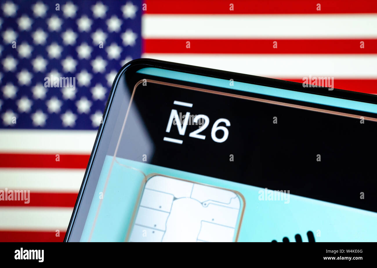 N26 Bank app start screen on the smartphone display with the US flag on the background. Conceptual photo for digital bank entering US market. Stock Photo