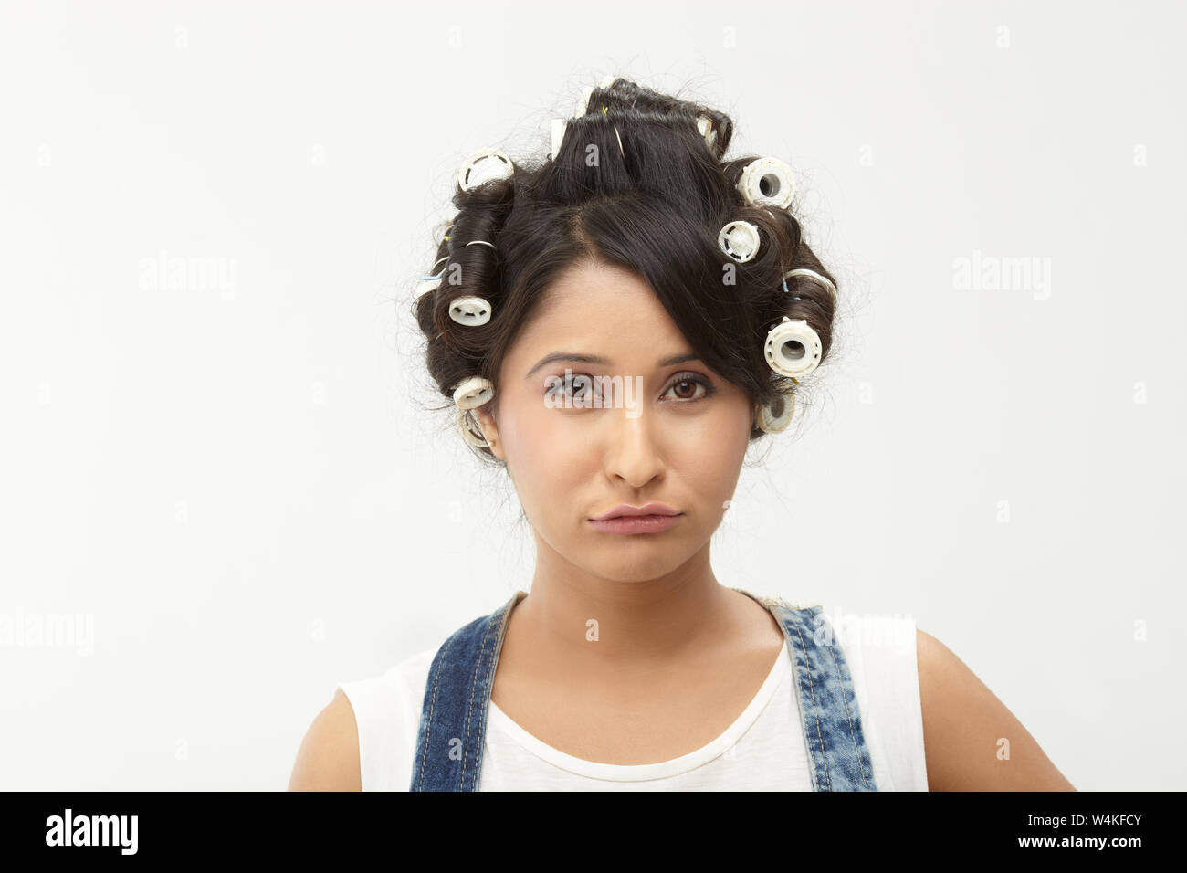 Indian woman with rollers in hair Stock Photo - Alamy