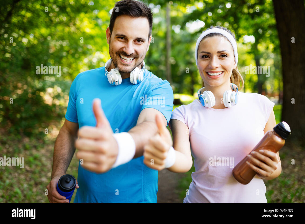 Happy couple running and exercising together outdoor Stock Photo - Alamy