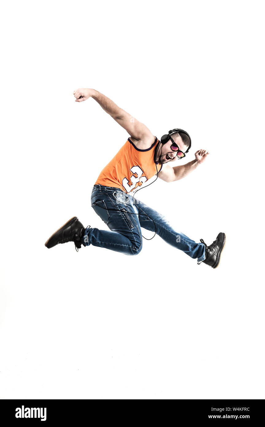 charming guy - rapper in headphones takes the dance break.photo on a ...