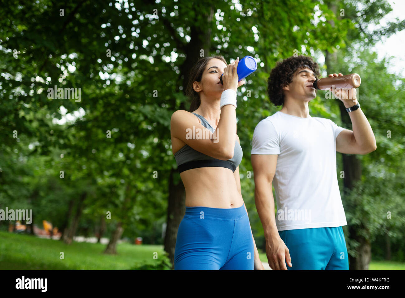 Couple jogging and running outdoors in nature Stock Photo - Alamy