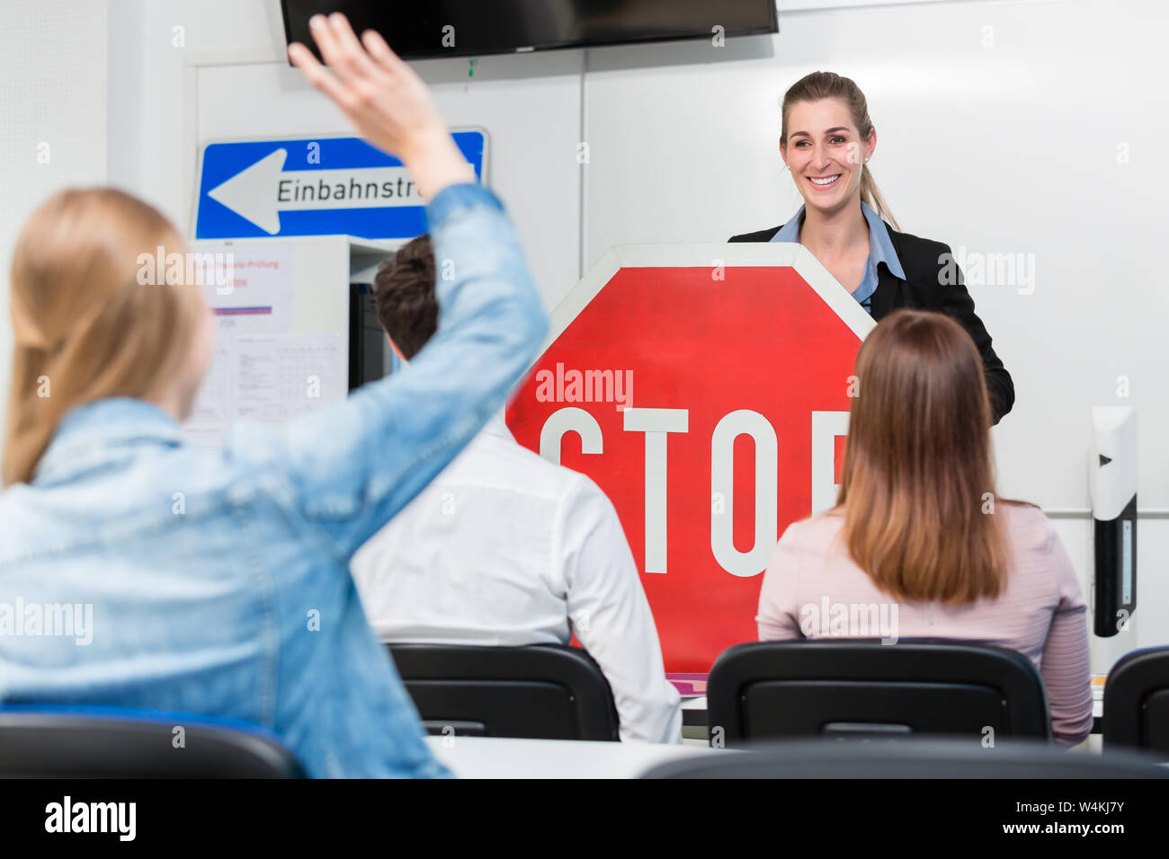 Teacher with class giving driving lessons Stock Photo