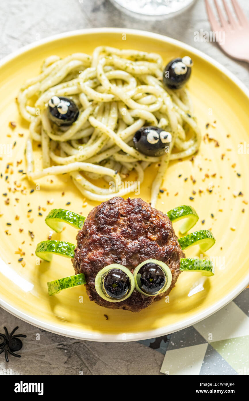 Cutlet spider with pesto pasta Stock Photo