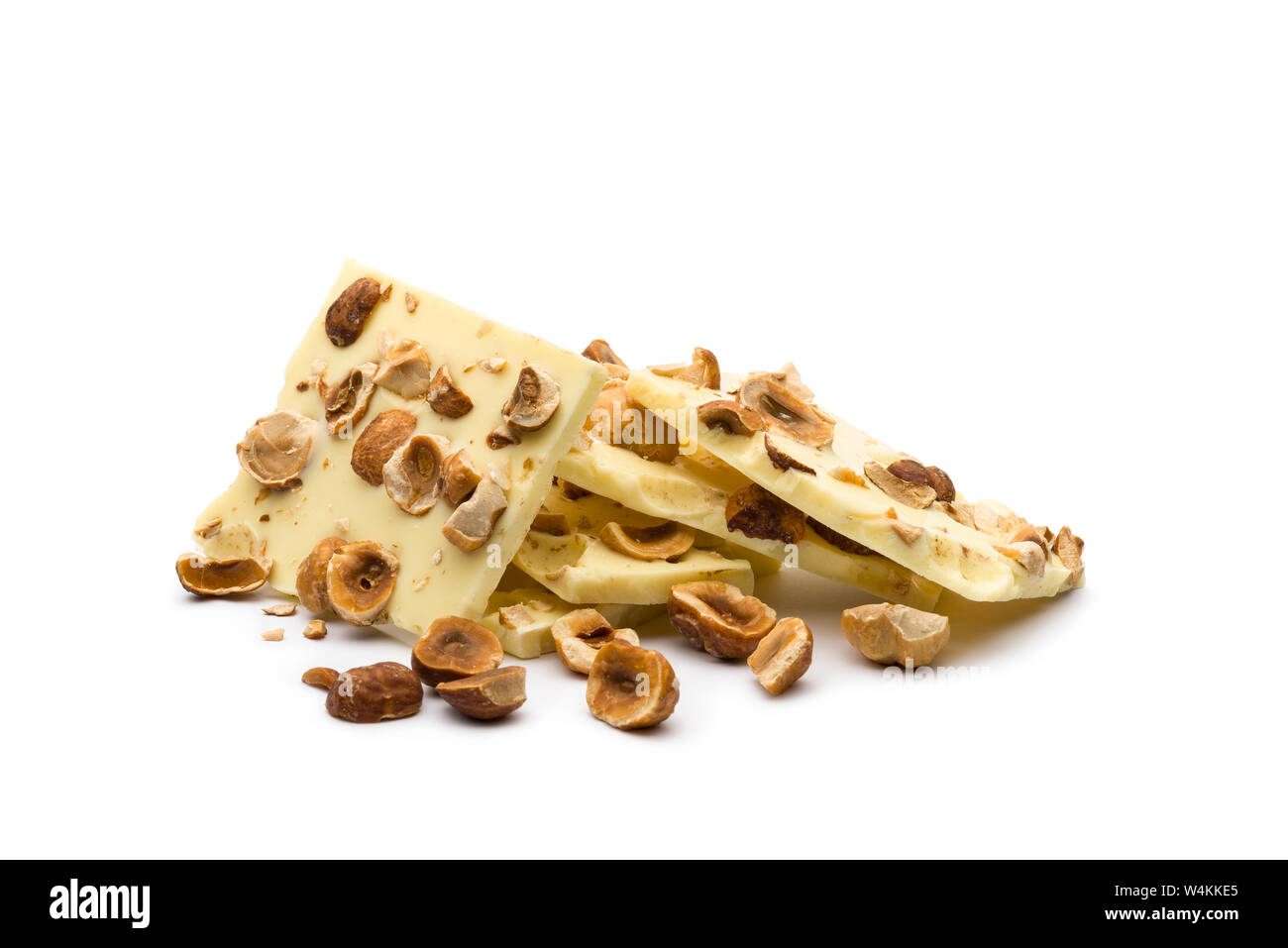hazelnut white chocolate chunks on white background Stock Photo