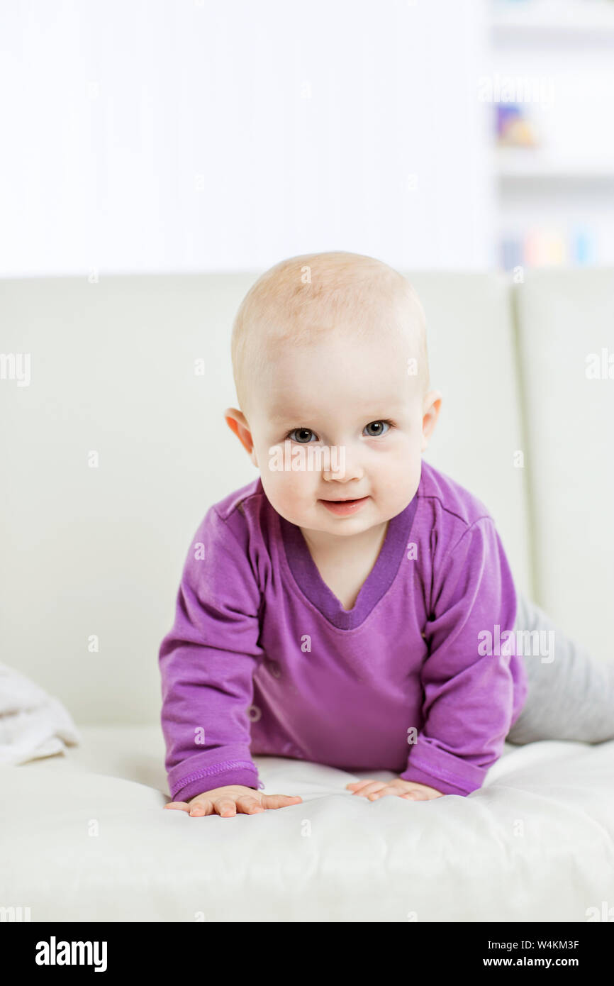 sweet-one-year-old-baby-girl-dressed-in-yellow-watering-the-plants-at