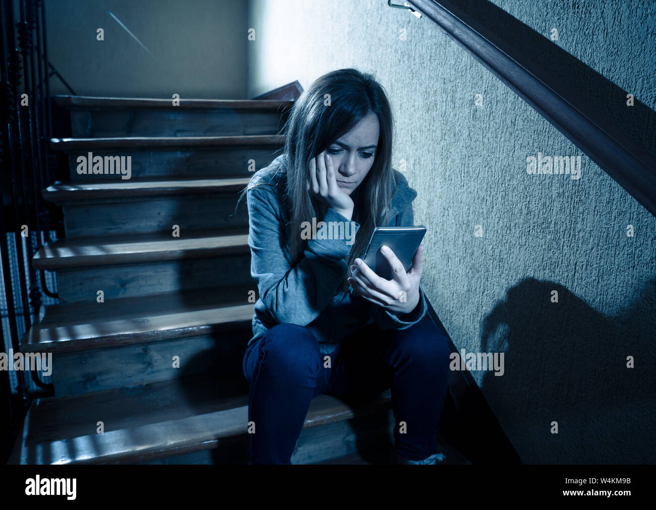 Teenager girl victim of online stalker suffering from cyberbullying