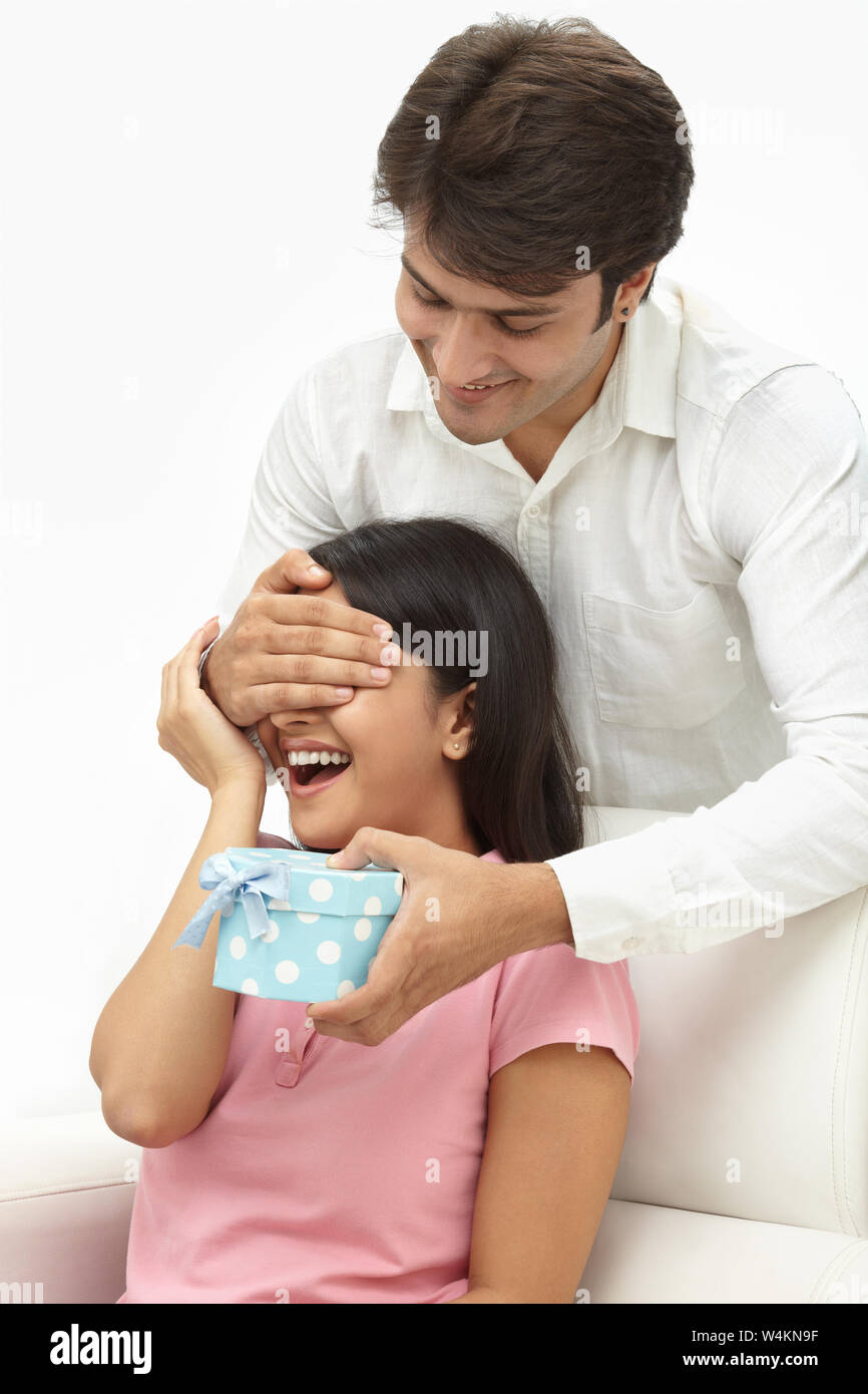 Man giving a gift to his wife Stock Photo Alamy