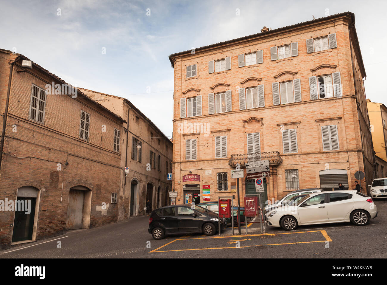 Fermo, Italy - February 11, 2016: Town square with parked cars in Fermo, Italian old town Stock Photo