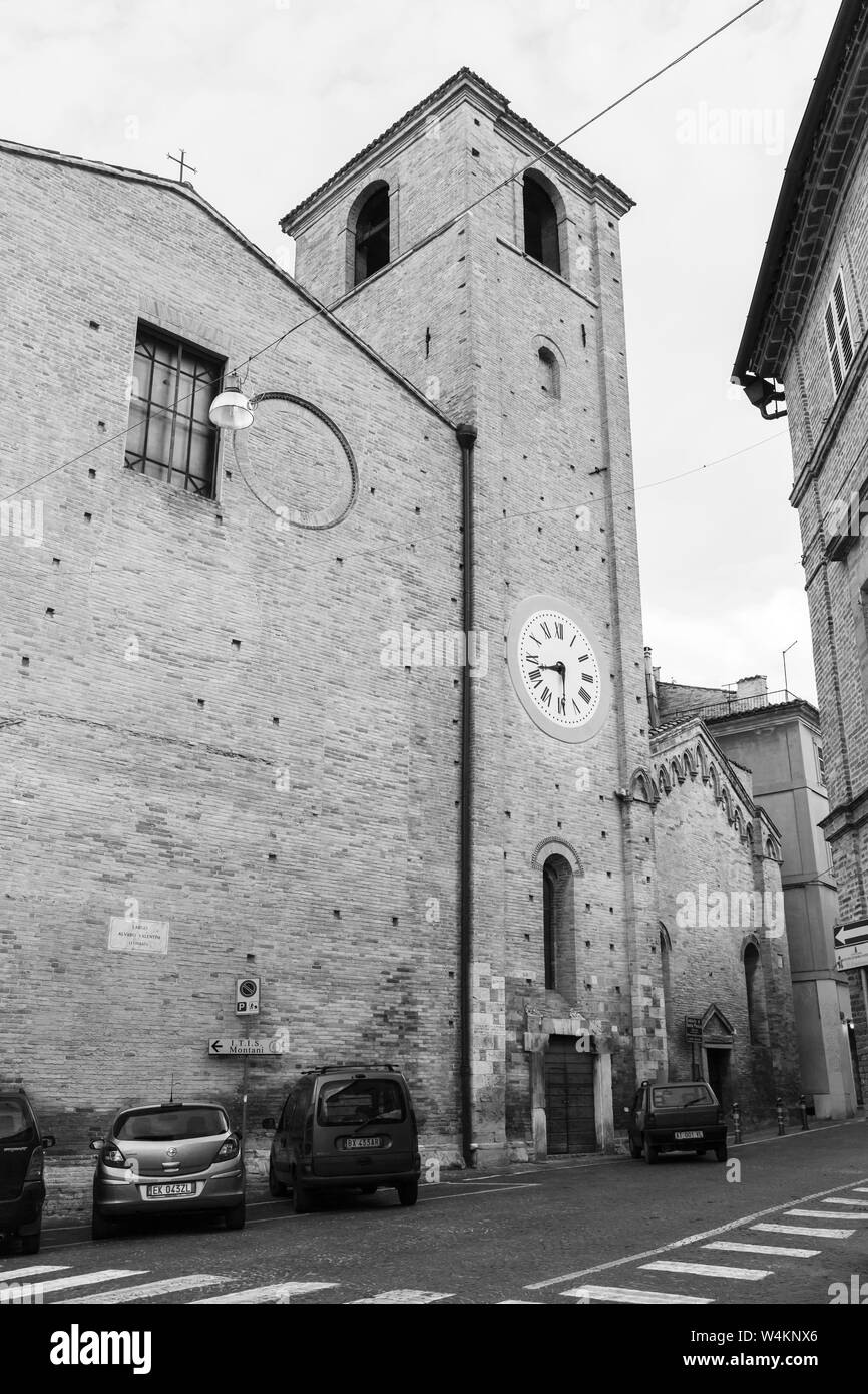 Fermo, Italy - February 12, 2016: San Agostino cathedral, clock tower. Black and white street view of Fermo town Stock Photo