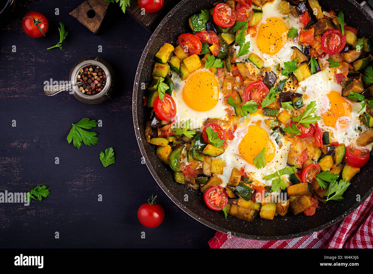 Late breakfast fried eggs with vegetables. Shakshuka. Arabic cuisine