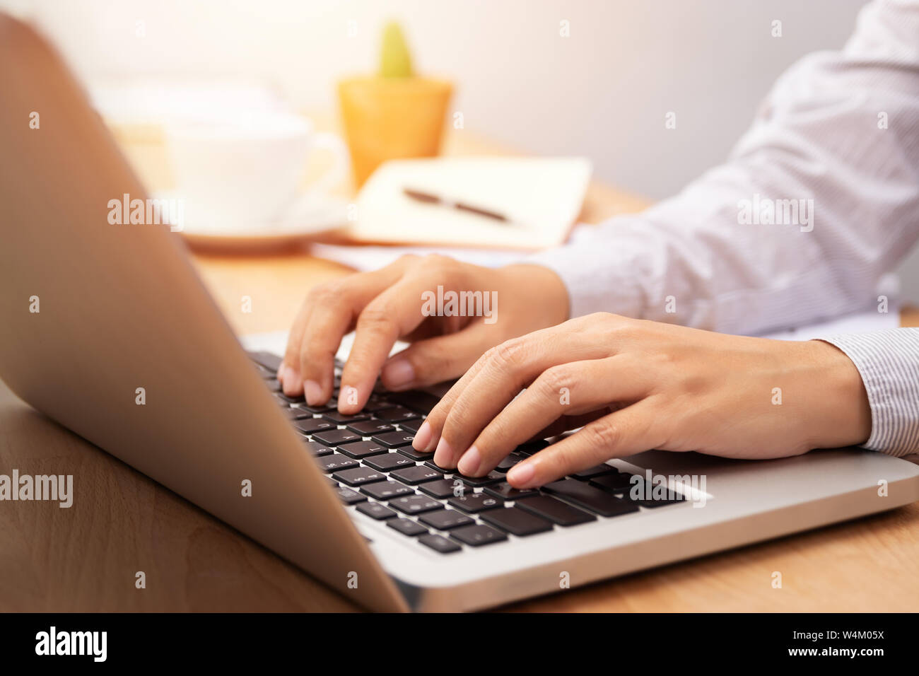 businesswoman working with notebook laptop computer, using finger with keyboard for typing or keying Stock Photo
