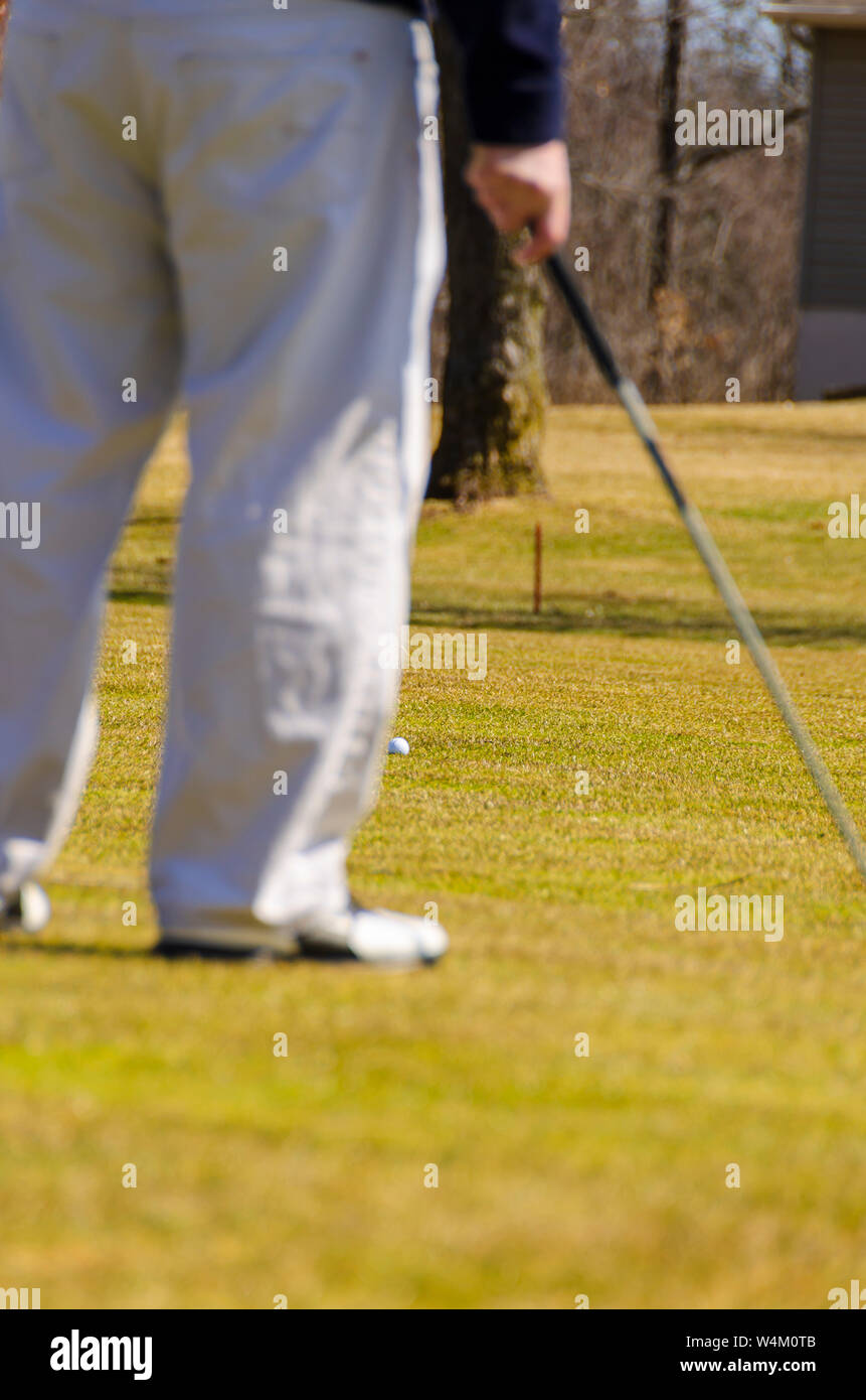 A golfer waiting for his turn on the fairway. Stock Photo